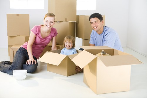 Coulsdon removals van helping with furniture and boxes at a residential property