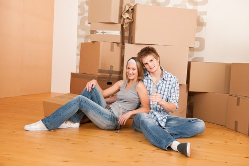 Packed boxes and household items being organised for a removal van move